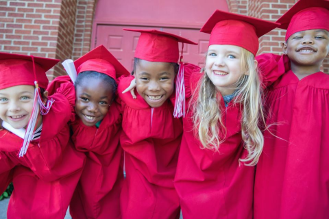kids in graduation gowns