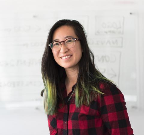 Woman by whiteboard