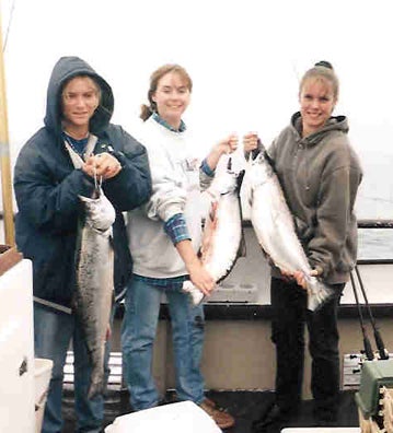 3 girls holding fish