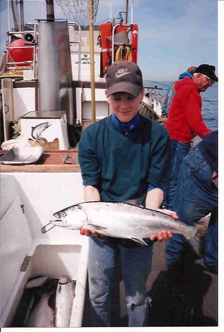 boy holding fish