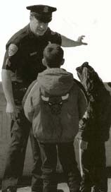 Cop speaking with child