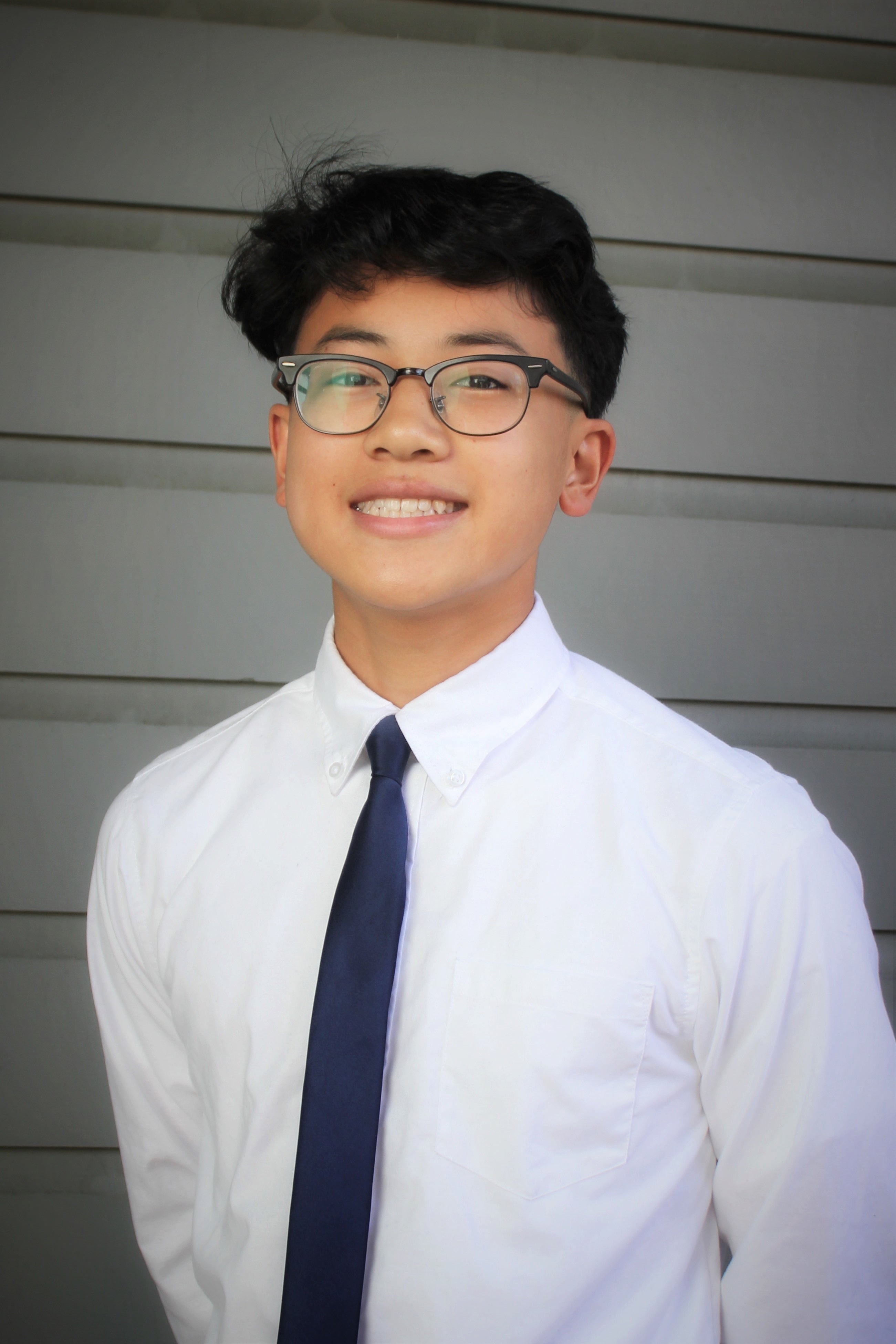 Picture of Jayden Tanaka, D1 Youth Commissioner, smiling at the camera